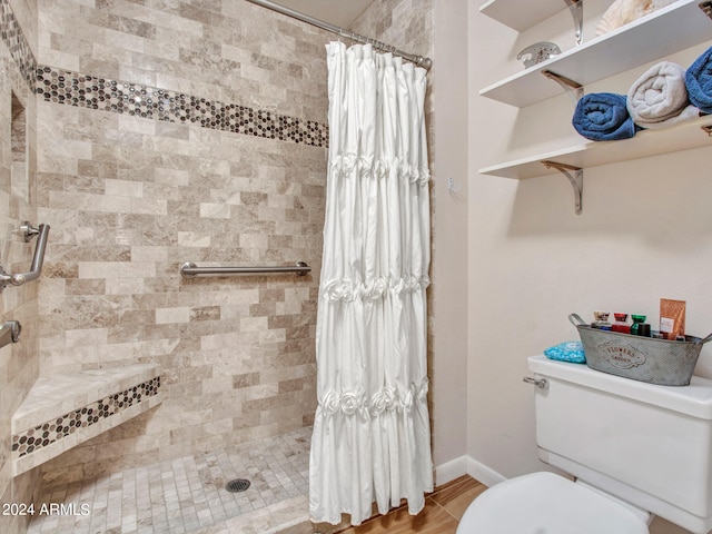 bathroom with toilet and curtained shower