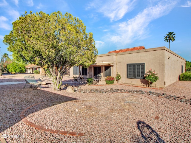 rear view of house featuring a patio area