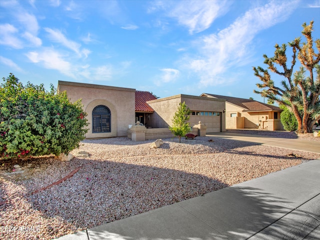 view of front of property with a garage