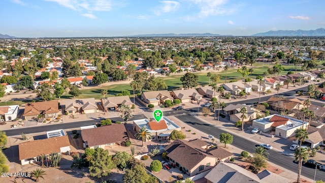 birds eye view of property featuring a mountain view