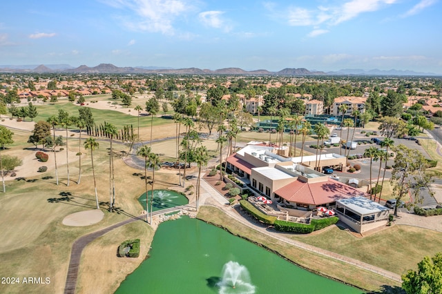 drone / aerial view featuring a water and mountain view