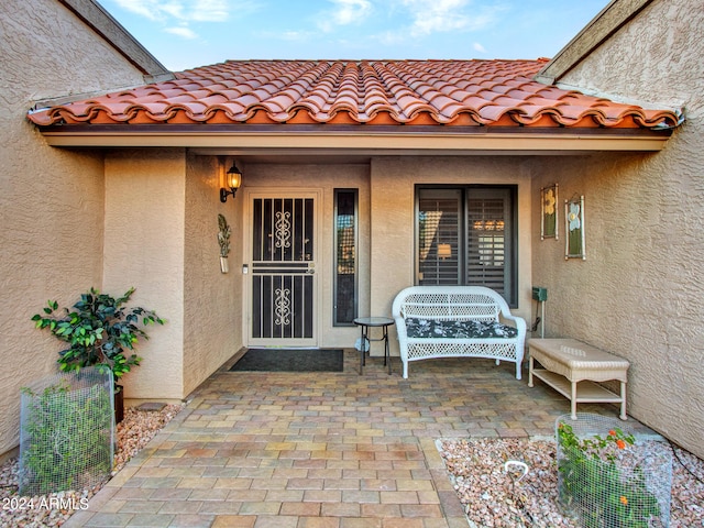 entrance to property with a patio area