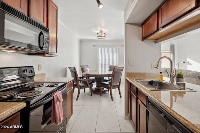 kitchen with a healthy amount of sunlight, sink, crown molding, and black appliances