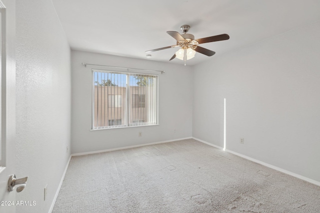 spare room with ceiling fan and carpet floors