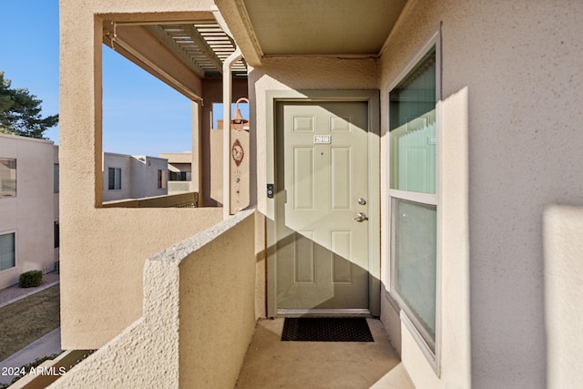 property entrance with a balcony