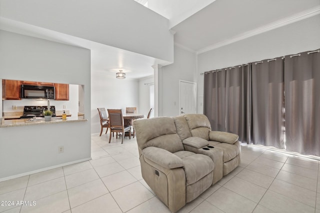 tiled living room with a towering ceiling