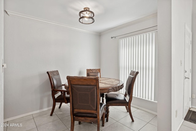 tiled dining area with crown molding