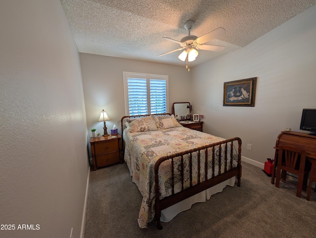 bedroom with ceiling fan, baseboards, carpet floors, and a textured ceiling