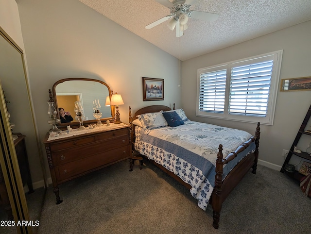 bedroom featuring lofted ceiling, a textured ceiling, dark colored carpet, baseboards, and ceiling fan