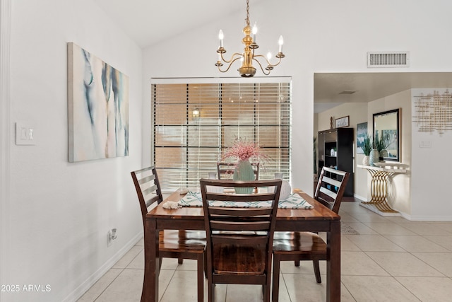 dining room featuring visible vents, baseboards, lofted ceiling, an inviting chandelier, and light tile patterned flooring