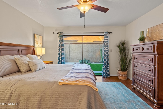 bedroom with access to exterior, baseboards, ceiling fan, and wood finished floors