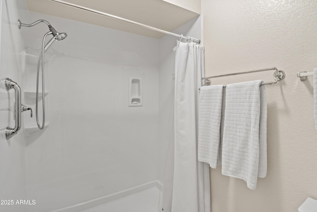 bathroom featuring a shower with curtain