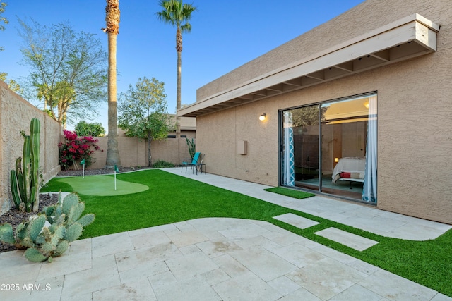 view of yard with a patio area and a fenced backyard