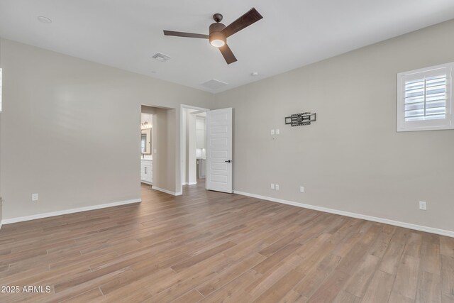 unfurnished room with visible vents, baseboards, light wood-style flooring, and a ceiling fan