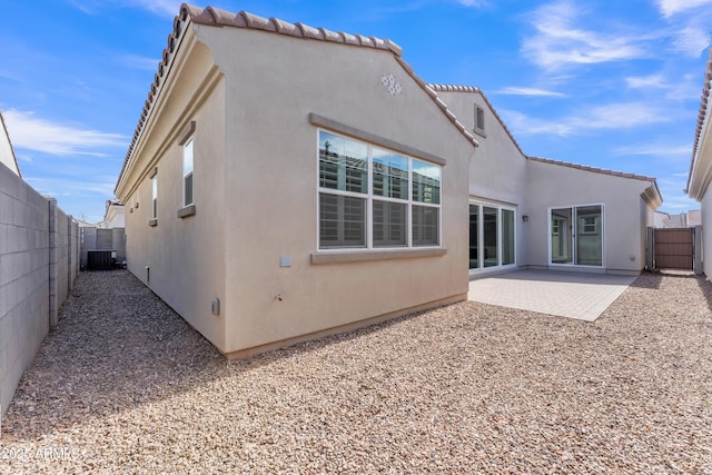 back of property featuring a patio area, a fenced backyard, and stucco siding