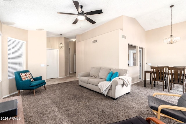 living room featuring a textured ceiling, carpet, vaulted ceiling, and ceiling fan with notable chandelier