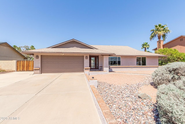 4534 E Beverly Ln, Phoenix, AZ 85032 - single story home with a garage, fence, stucco siding, driveway, and roof with shingles