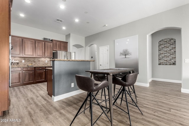 dining space featuring light hardwood / wood-style flooring