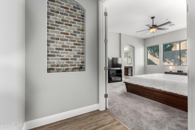 bedroom with ceiling fan and hardwood / wood-style floors