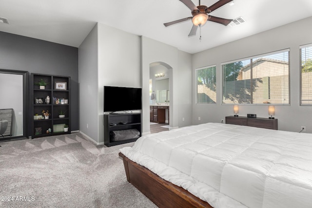 bedroom with carpet, ceiling fan, and ensuite bathroom