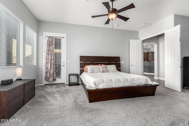 carpeted bedroom with ceiling fan