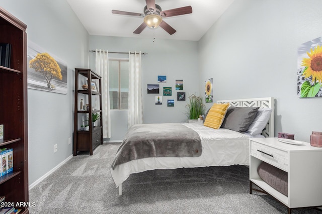 bedroom featuring light carpet and ceiling fan