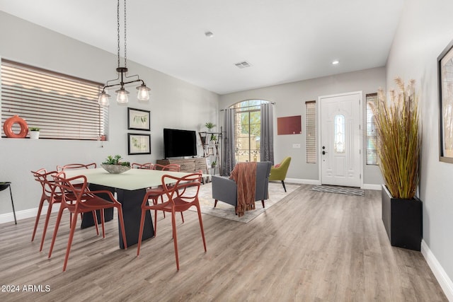 dining area with light hardwood / wood-style floors