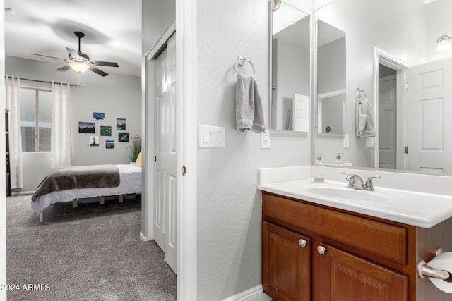 bathroom featuring ceiling fan and vanity