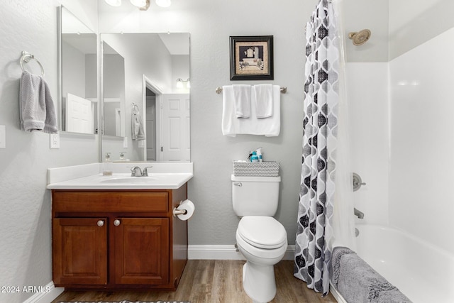 full bathroom with toilet, vanity, shower / tub combo, and hardwood / wood-style flooring