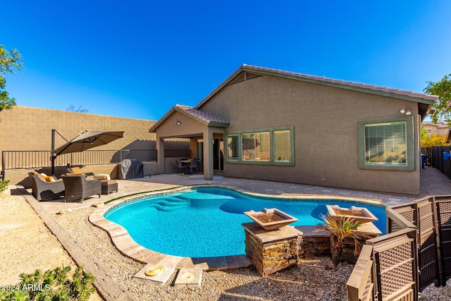 view of swimming pool with outdoor lounge area and a patio