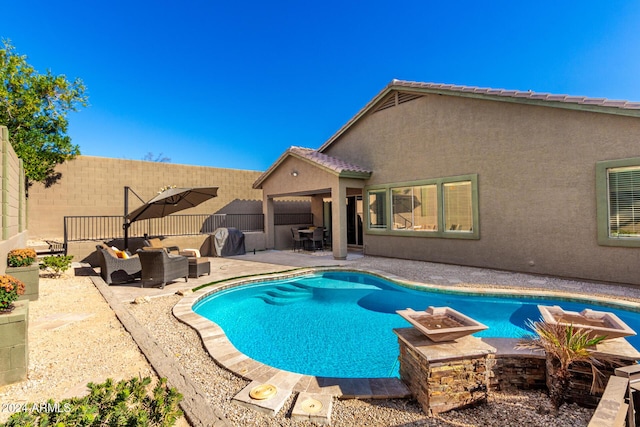 view of swimming pool with outdoor lounge area and a patio area