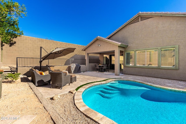 view of pool with a patio area and outdoor lounge area