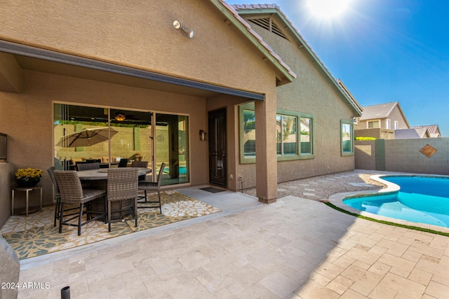 exterior space featuring a fenced in pool