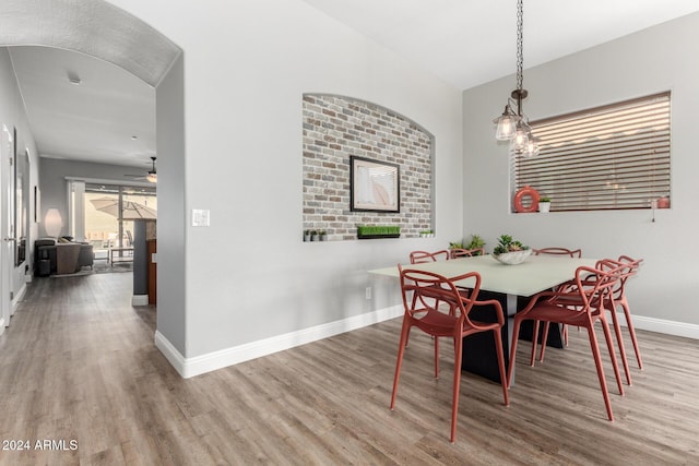 dining space featuring ceiling fan and hardwood / wood-style floors