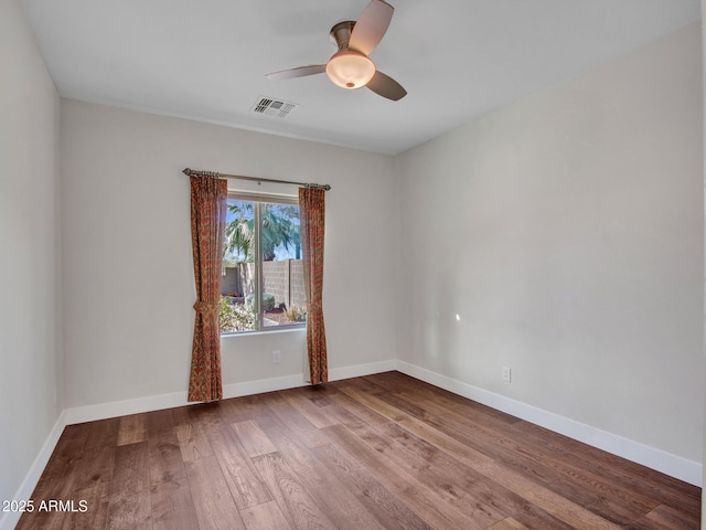 unfurnished room featuring hardwood / wood-style flooring and ceiling fan