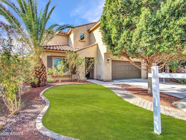 mediterranean / spanish-style house featuring a garage and a front yard