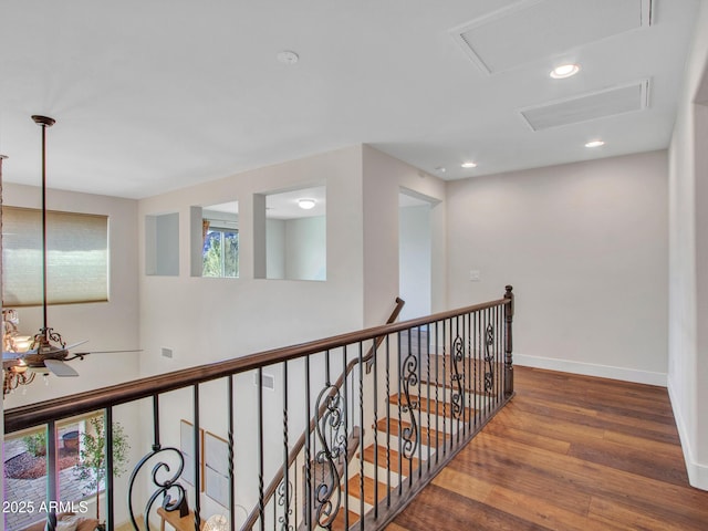 hall with hardwood / wood-style floors