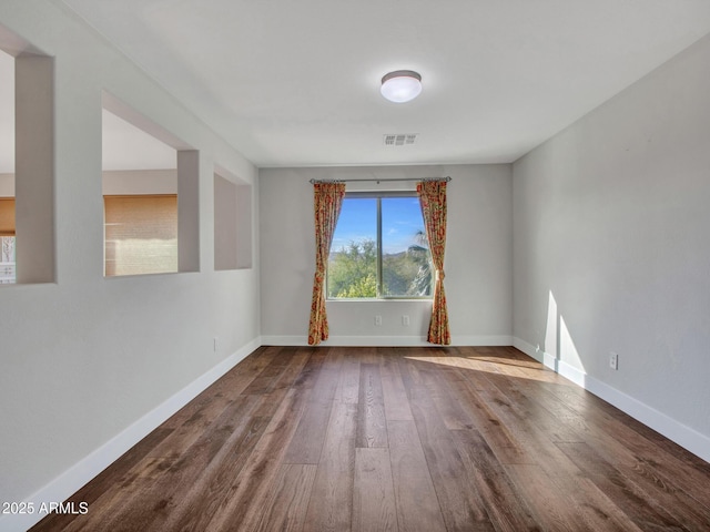 empty room featuring wood-type flooring