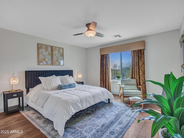 bedroom featuring ceiling fan and wood-type flooring