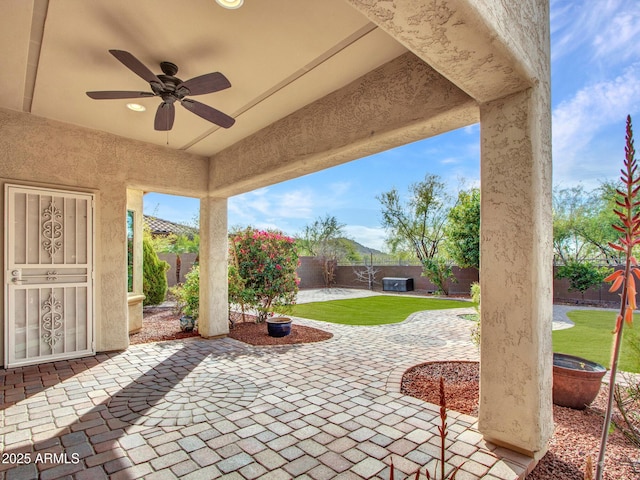 view of patio featuring ceiling fan