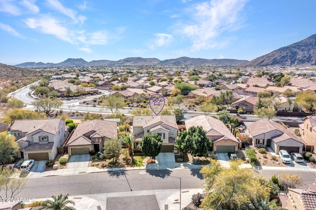 birds eye view of property featuring a mountain view