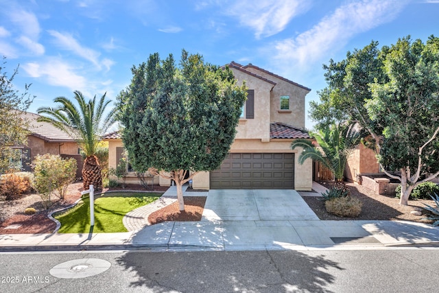 mediterranean / spanish-style home with a garage