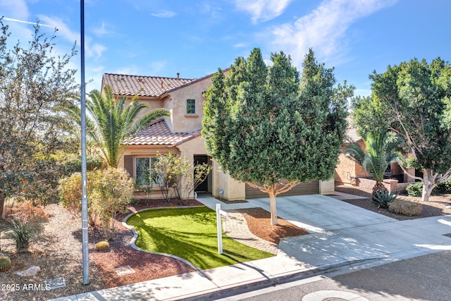 mediterranean / spanish house featuring a garage and a front lawn