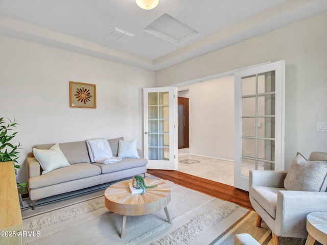 living room featuring french doors and wood-type flooring