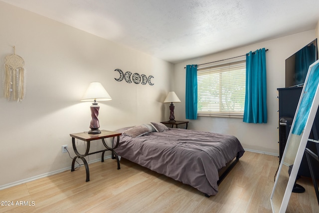 bedroom with light hardwood / wood-style flooring