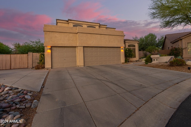 southwest-style home with a garage