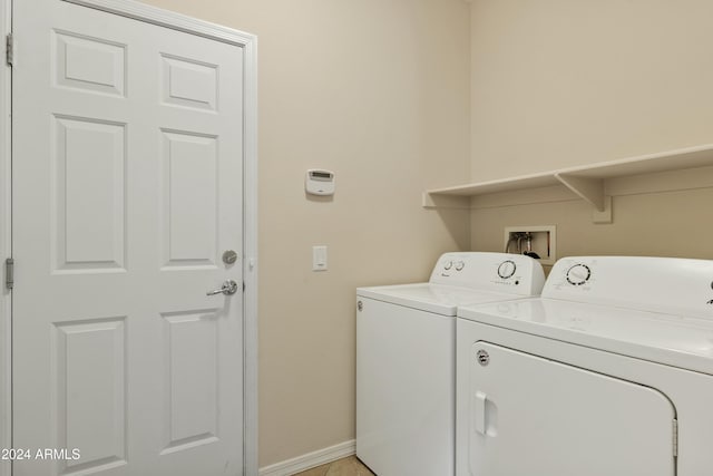 clothes washing area featuring independent washer and dryer