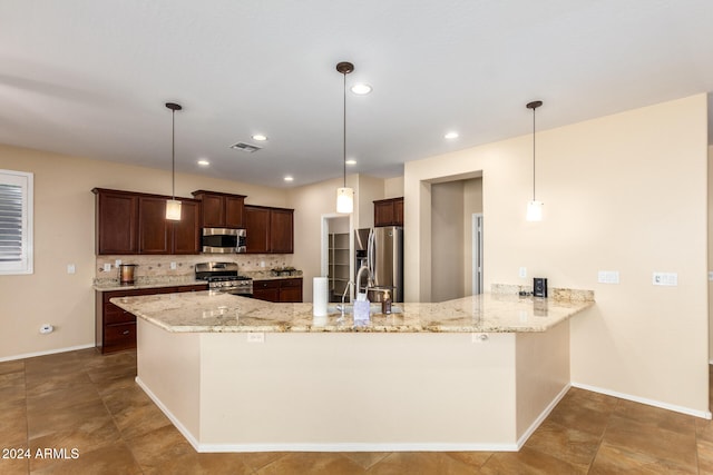 kitchen featuring backsplash, appliances with stainless steel finishes, decorative light fixtures, and kitchen peninsula