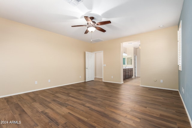 spare room featuring ceiling fan and dark hardwood / wood-style flooring