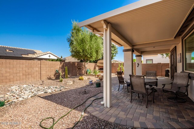 view of patio with a fenced backyard and outdoor dining space
